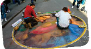 Discuss the question below with a partner. What do you know about street painting? (ảnh 1)