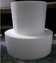 A stack of white rolls
Description automatically generated