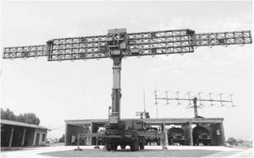 A large military antenna on a truck

Description automatically generated