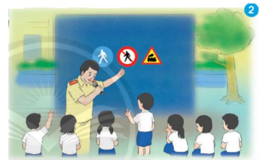 Chú công an giao thông và các bạn nhỏ đang làm gì? (ảnh 1)