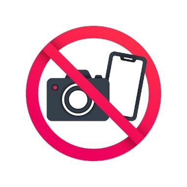 What does this sign mean?  	A. No talking. B. No taking photos or videos. C. Be quiet!  D. Put your shoes outside! (ảnh 1)