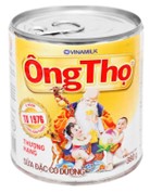 Một hộp sữa c&oacute; dạng h&igrave;nh trụ với b&aacute;n (ảnh 1)